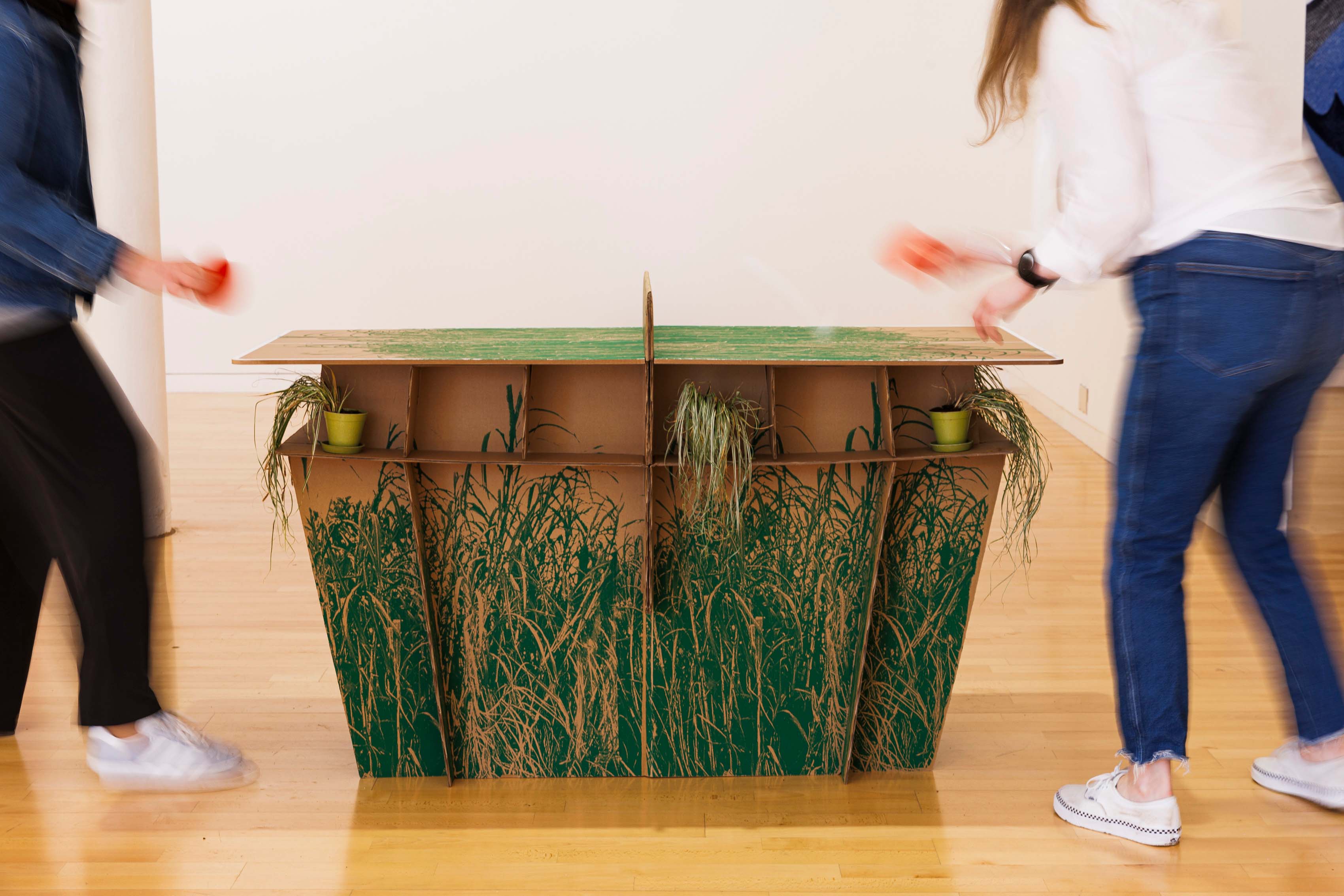 PLAY! Sugar Cane Ping Pong, 2024 screenprint, reinforced cardboard, sugar cane from indentured heritage sites in Mauritius, pampas grass, Installation view (Photo by Eoin Carey)